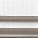 Stack of different textured drawing papers, from smooth Bristol to rough cold press, demonstrating various surfaces.