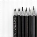 Collection of diverse professional graphite pencils, from hard 6H to soft 8B, neatly arranged.